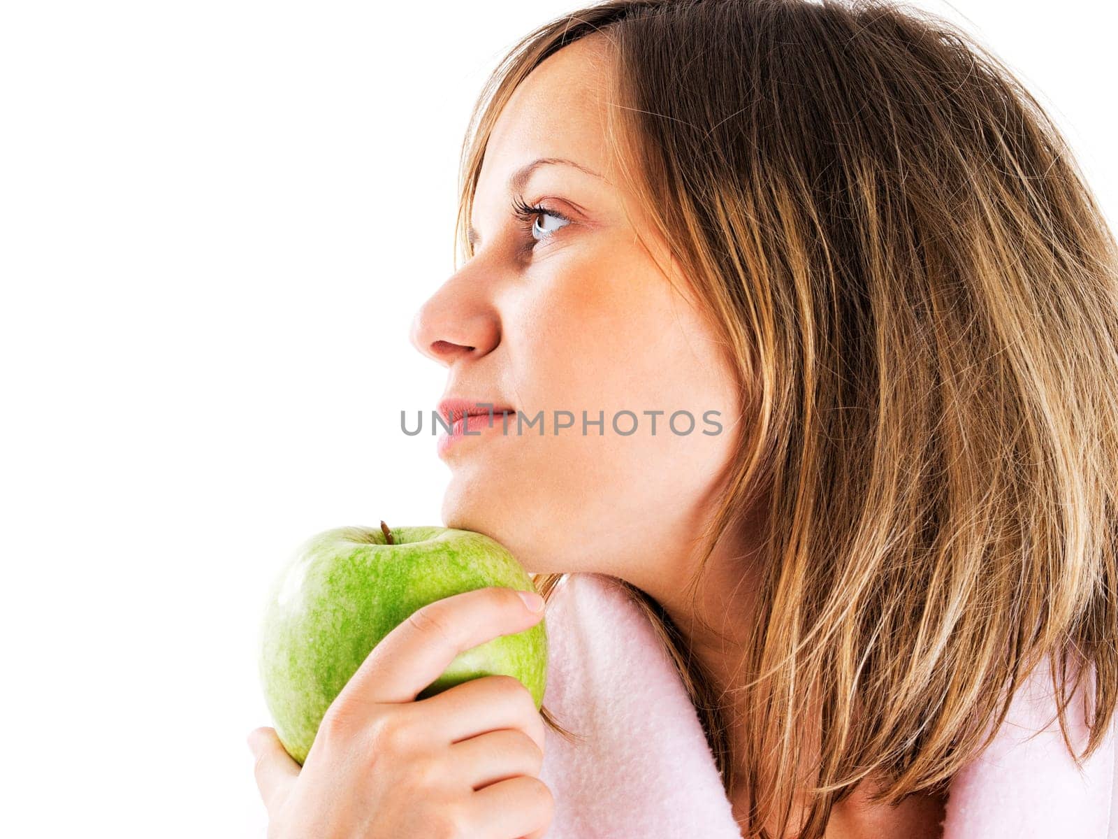 Woman in housecoat with apple