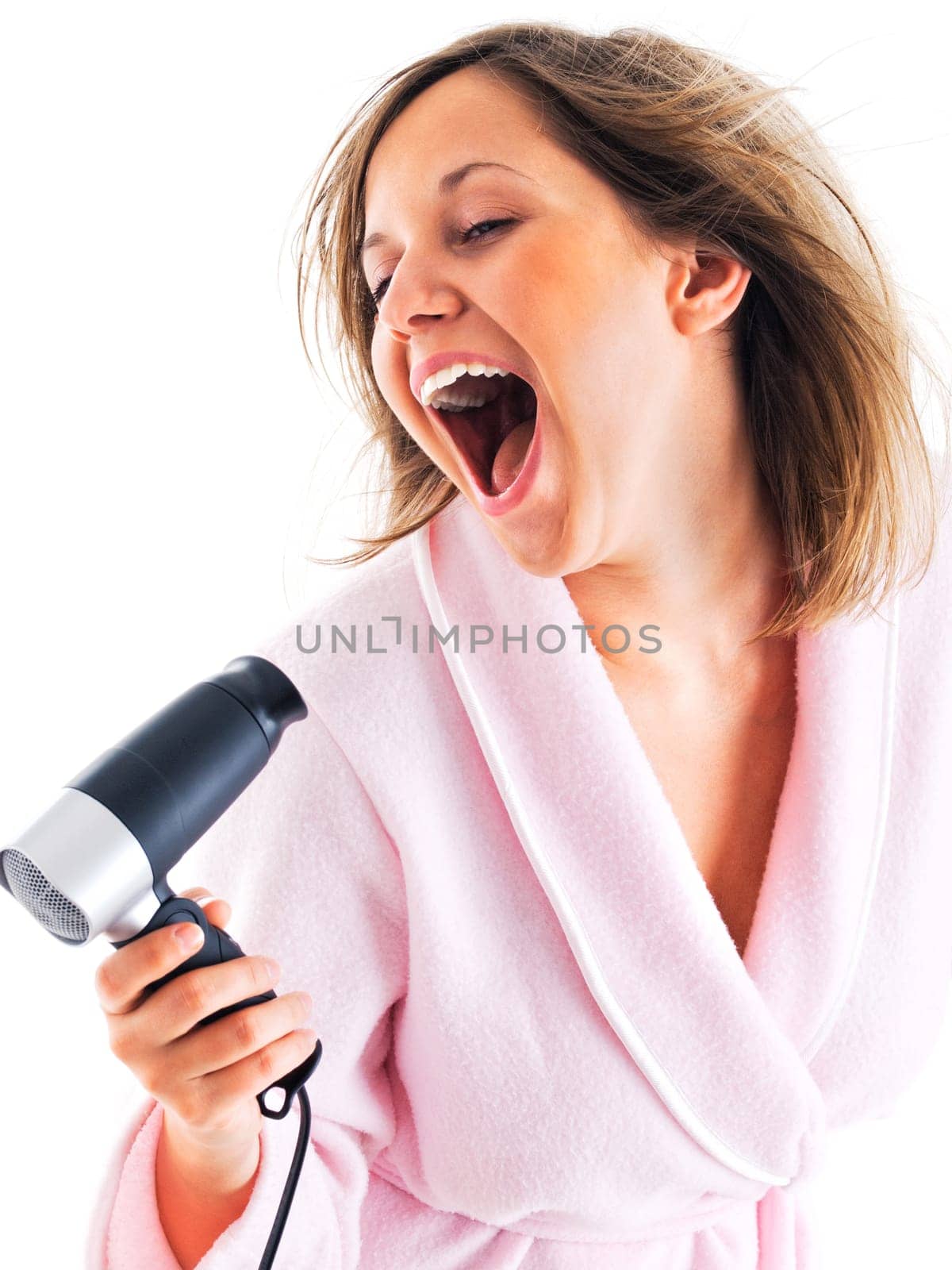 Woman singing with hair dryer