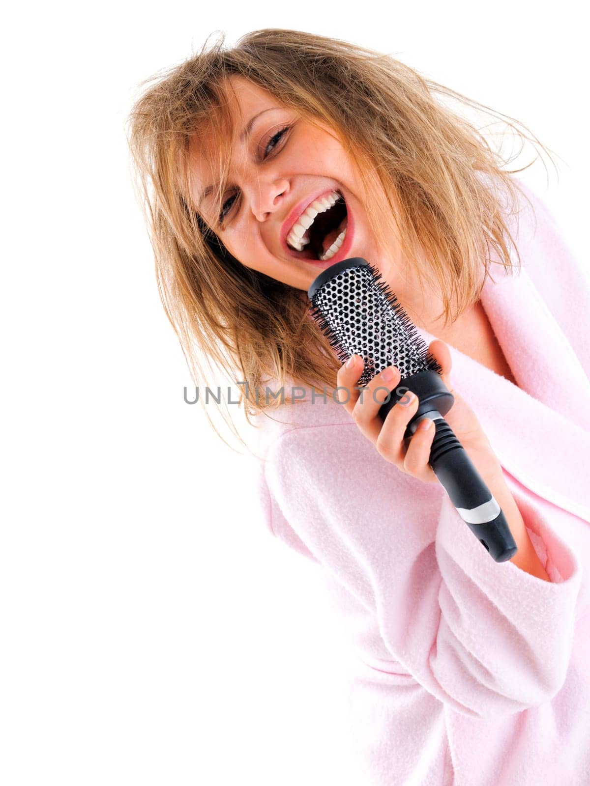 Woman singing with hairbrush
