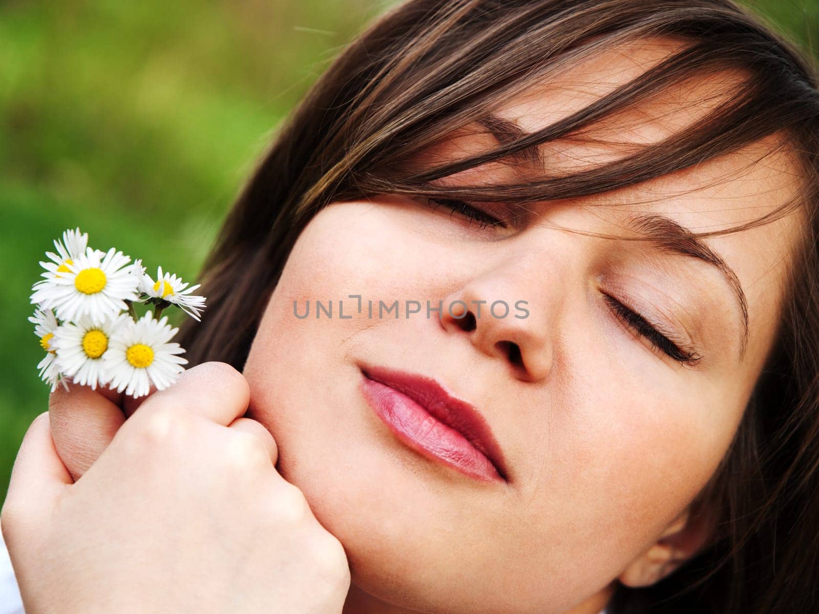 Woman with camomiles