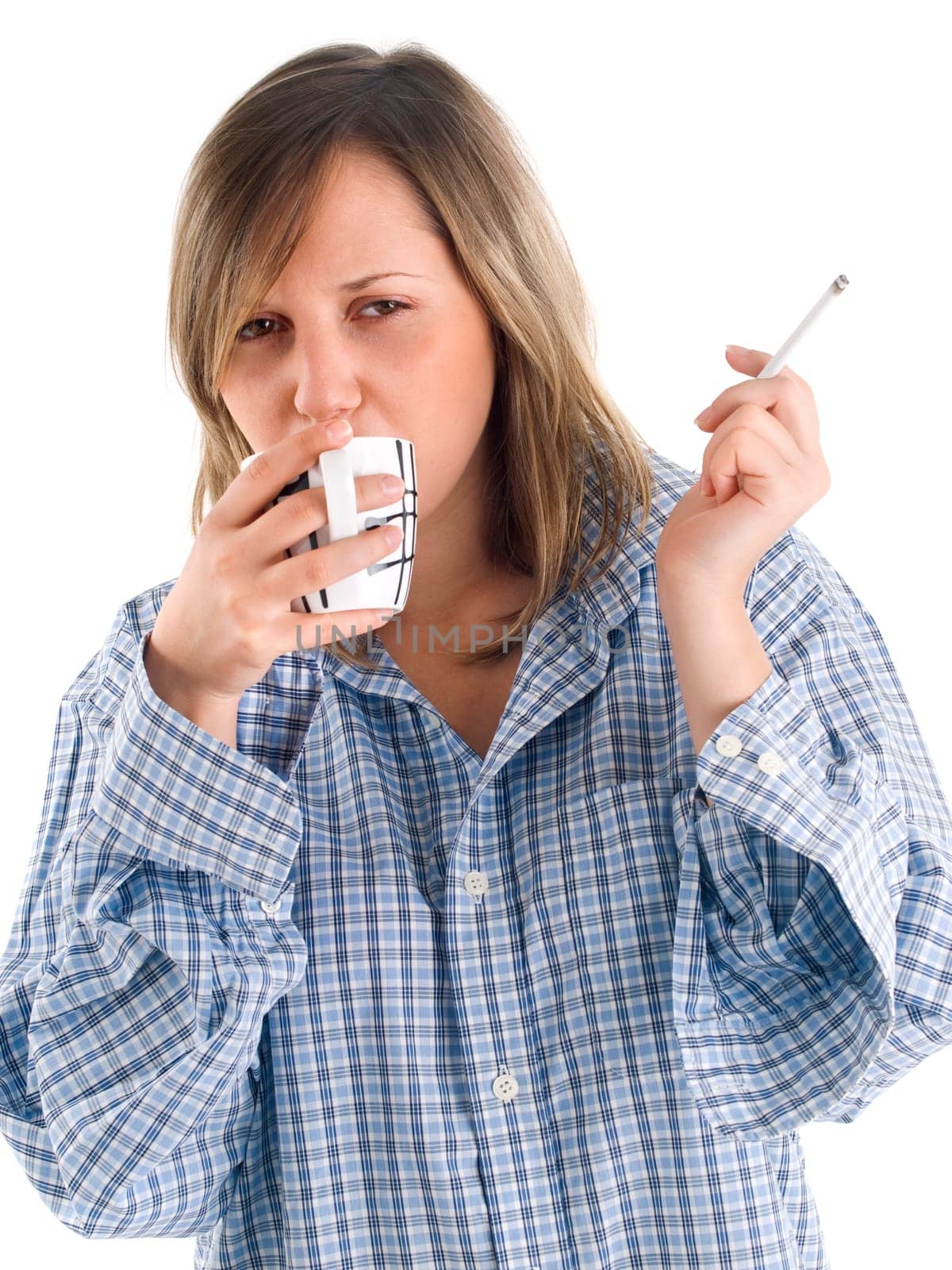 Young woman drinking coffee and smoking isolated on white