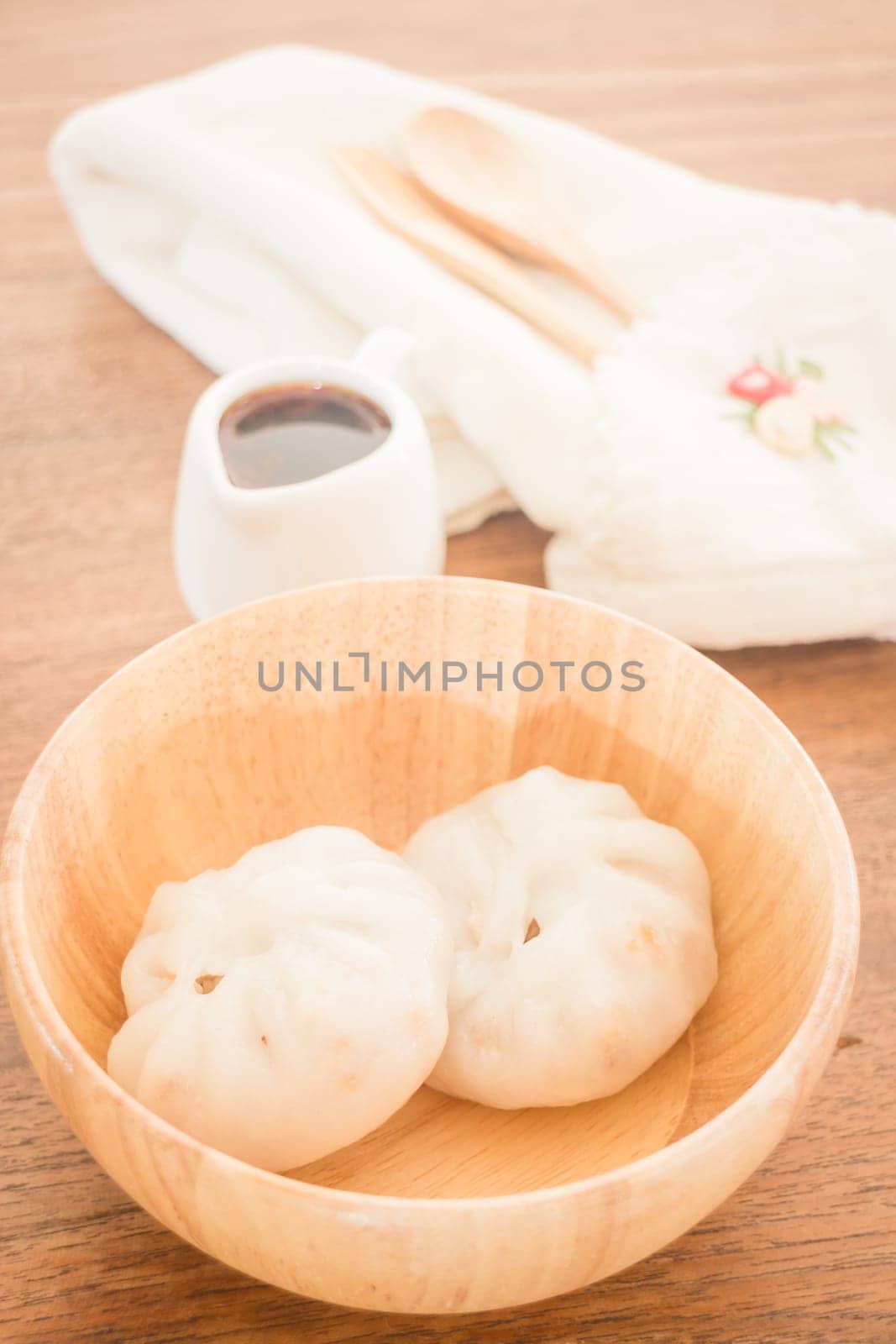 Steamed dumpling stuff on wooden bowl, stock photo