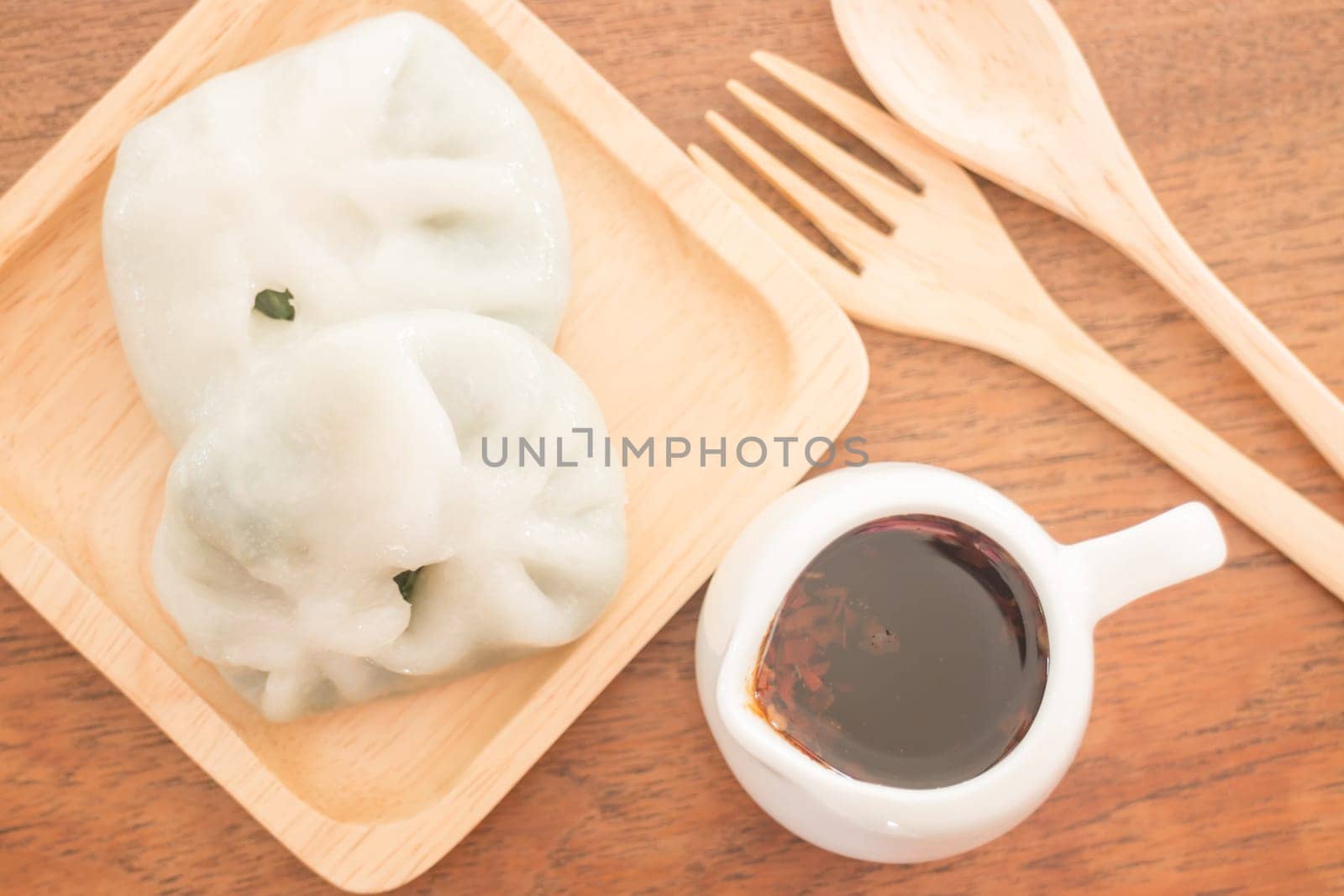 Steamed dumpling stuff serving on wooden plate, stock photo