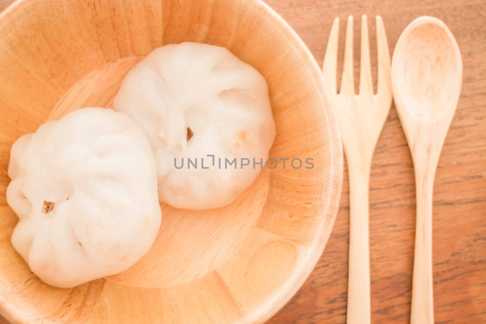 Steamed dumpling stuff on wooden bowl, stock photo