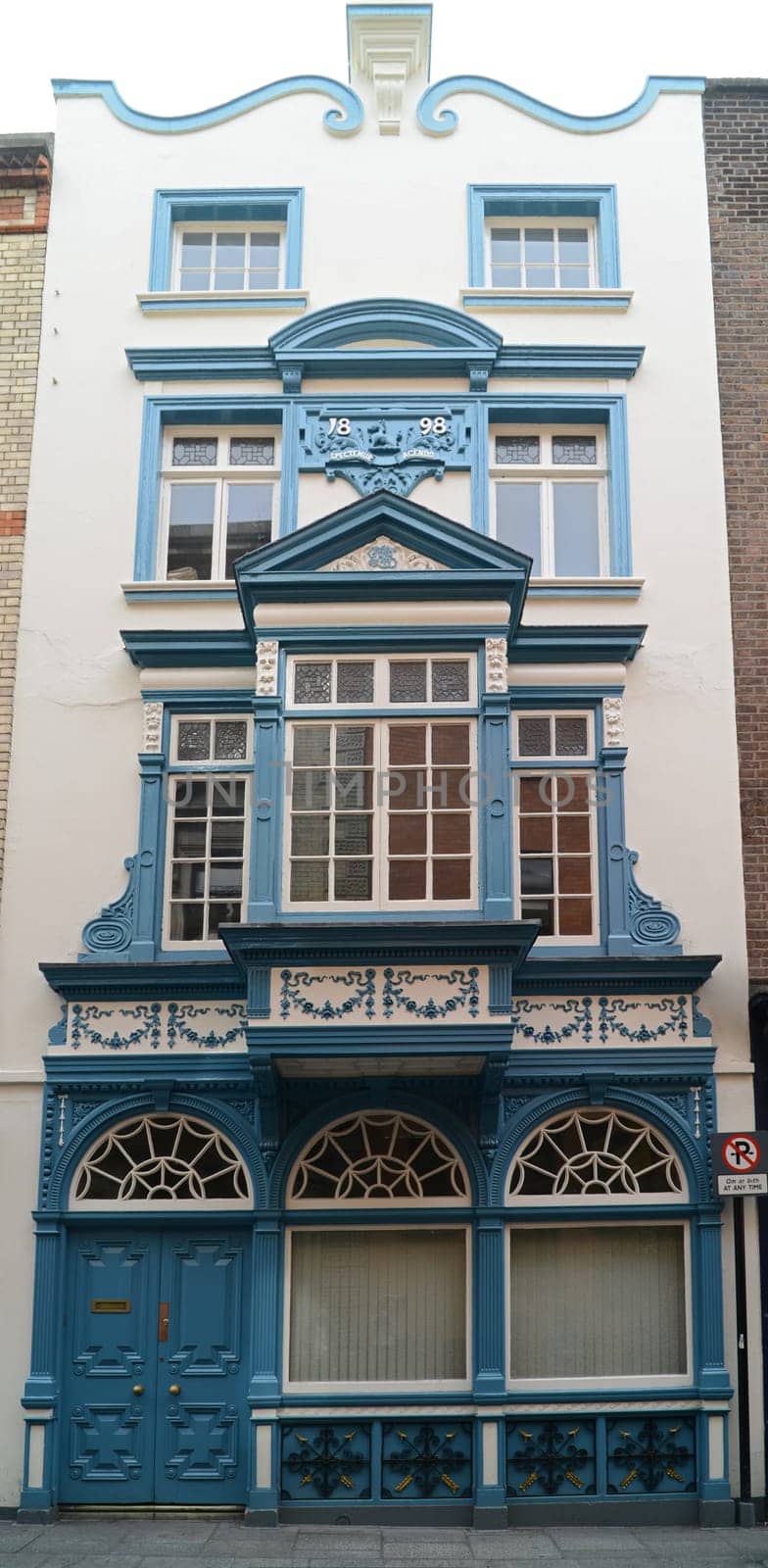 Beautiful narrow house from Dublin with blue decoration (Ireland).