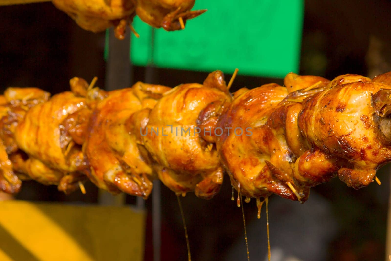 Chickens are roasted over an open fire