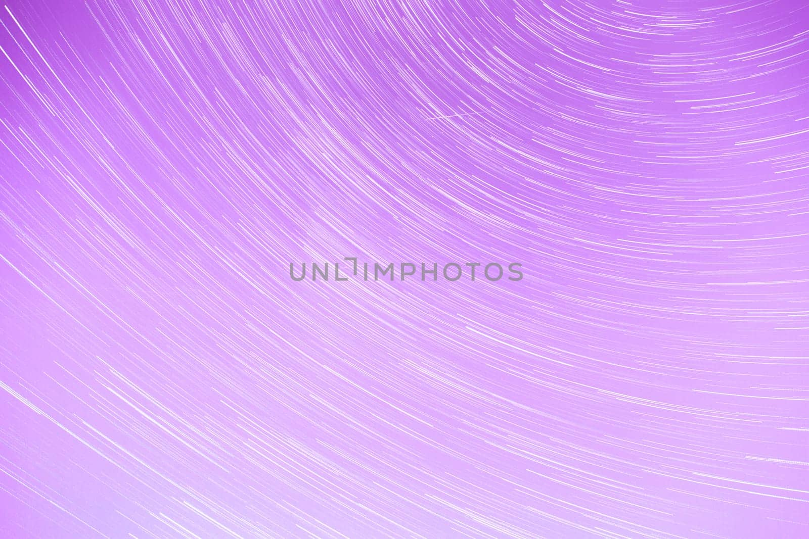 Star Trails streaking across a Purple Sky.
