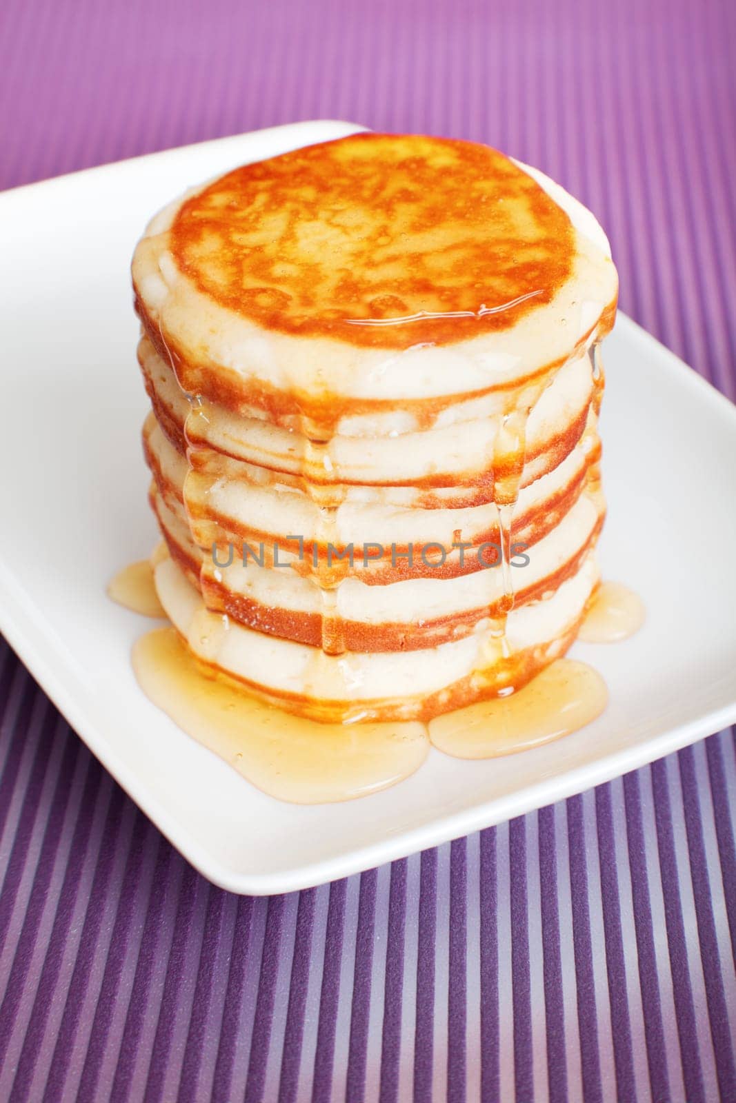 Typical american pancakes with honey