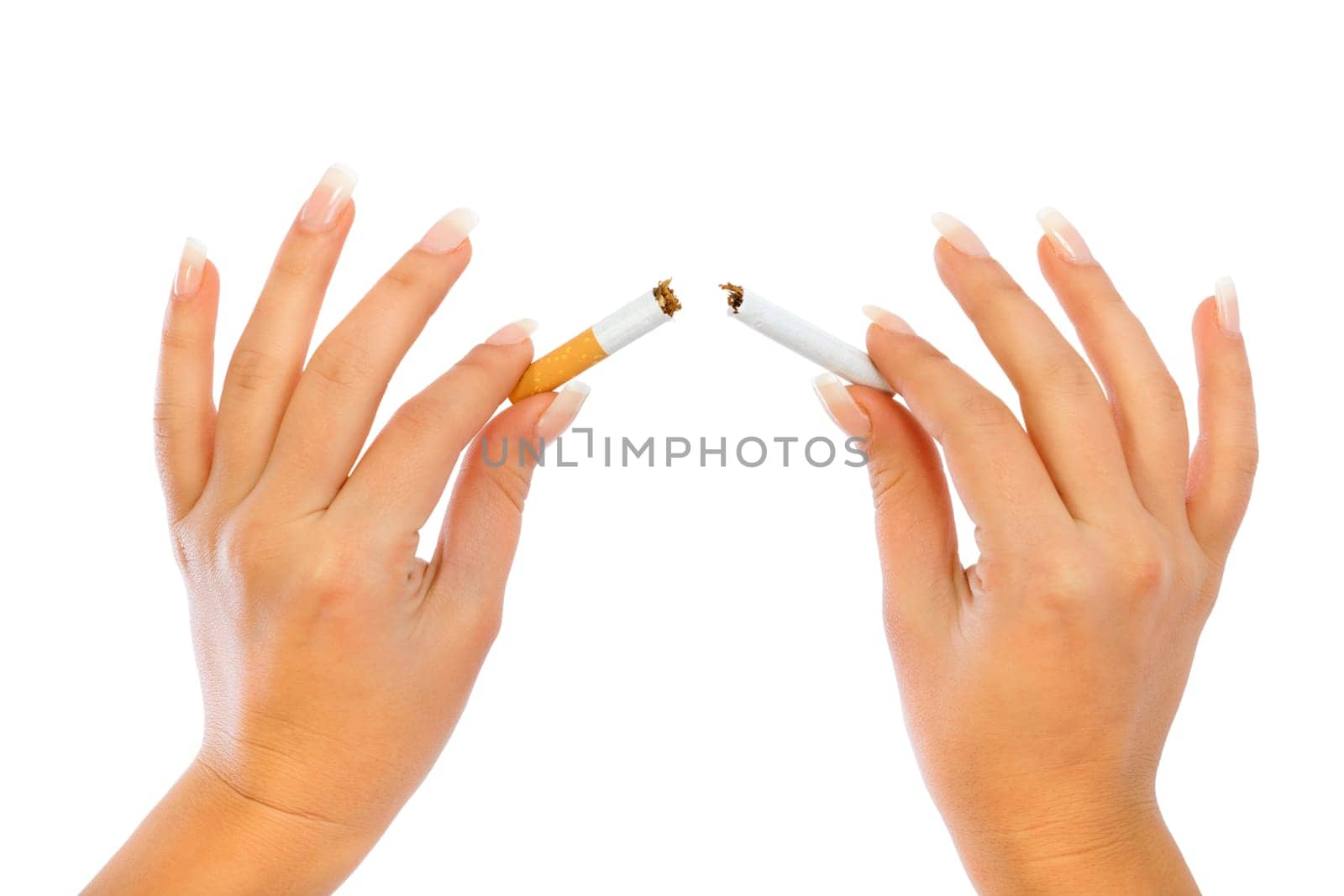 Young woman breaking a cigarette - close up of her hands