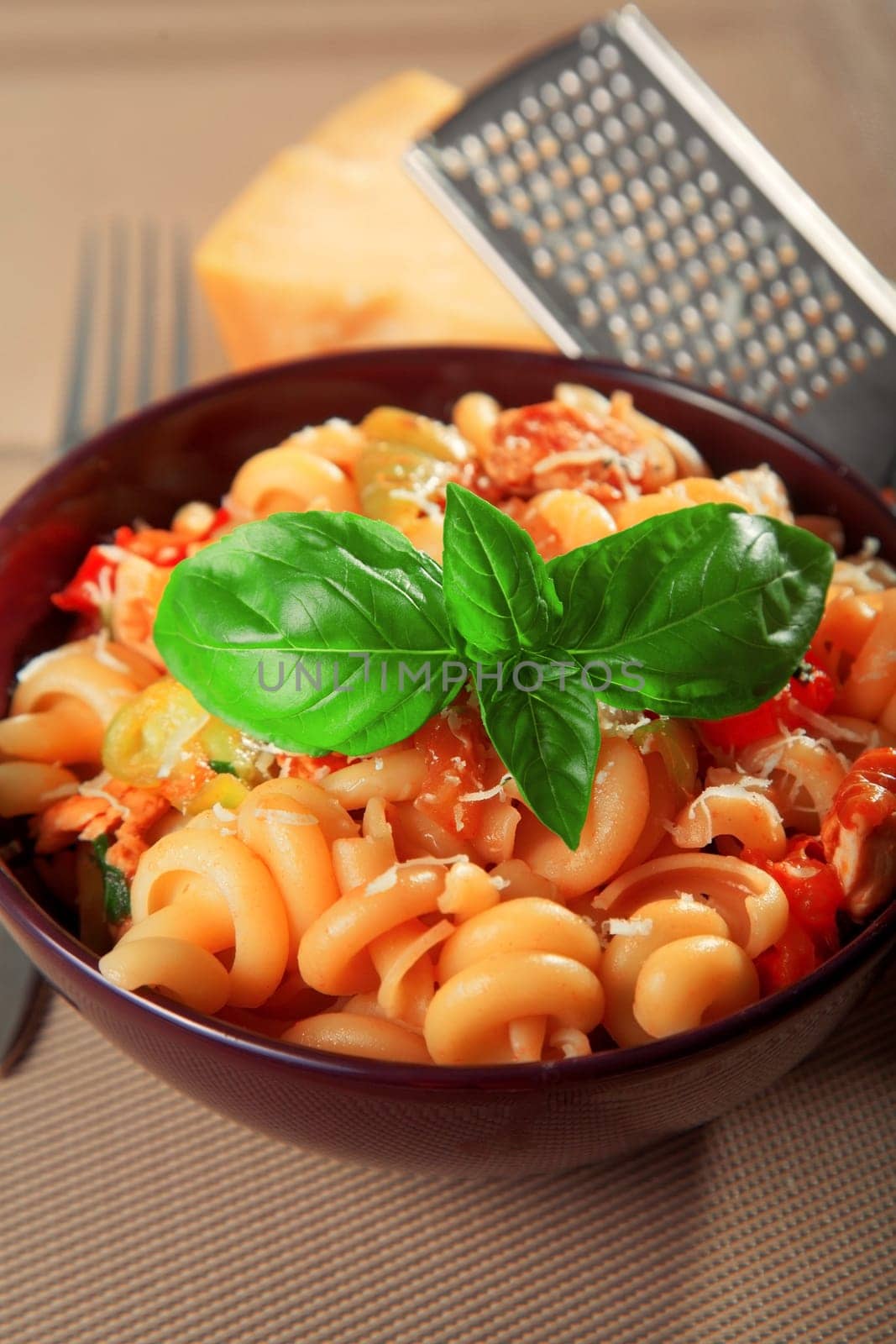 Pasta with cherry tomatos and parmesan cheese, one portion, ready to eat