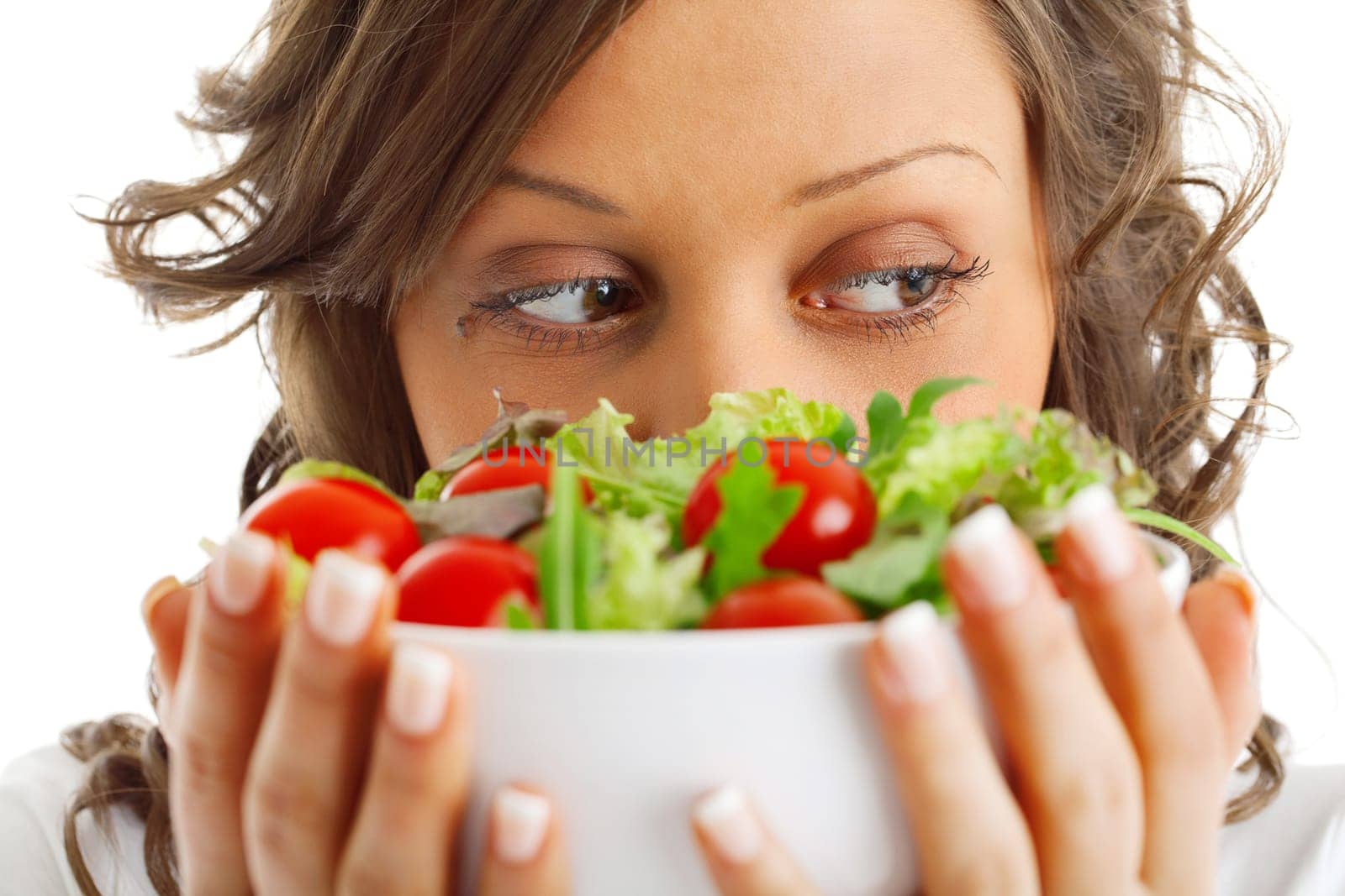 Young woman preparing healhty salad isolated on white background