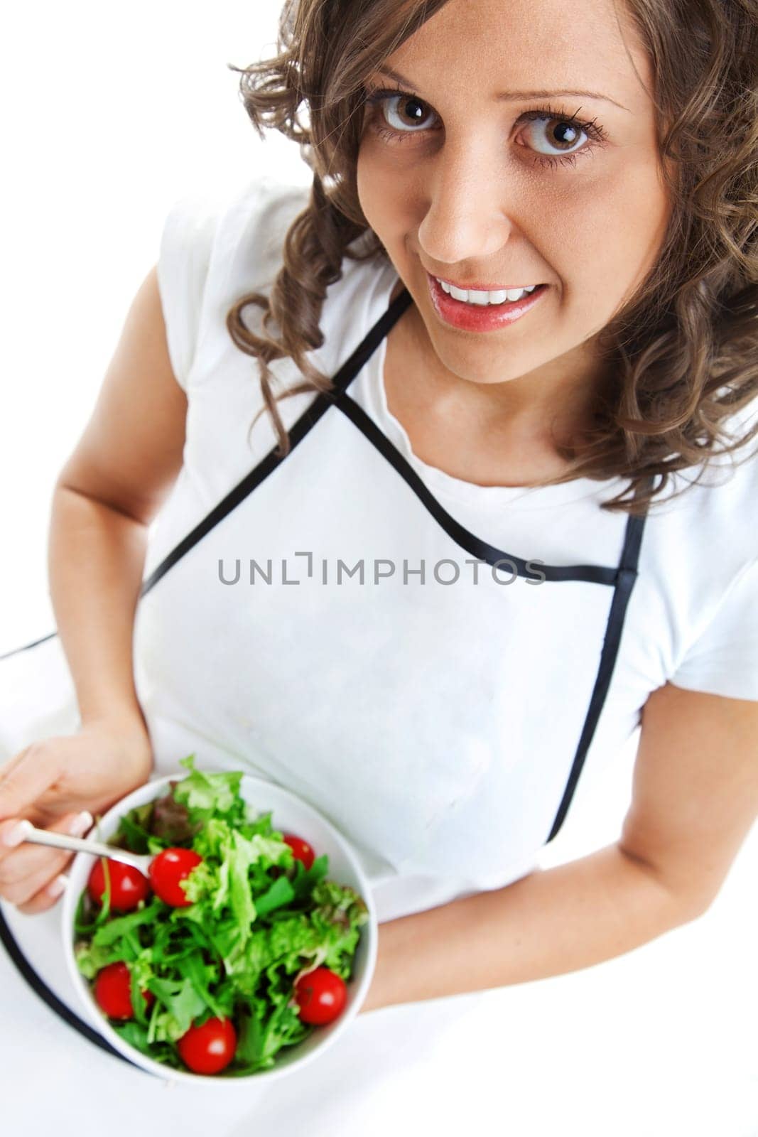 Youg woman eating healthy salad isolated on white background