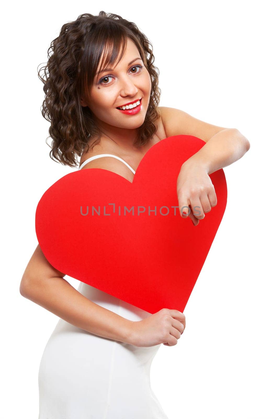 Young attractive woman holding red paper heart like a valentine card