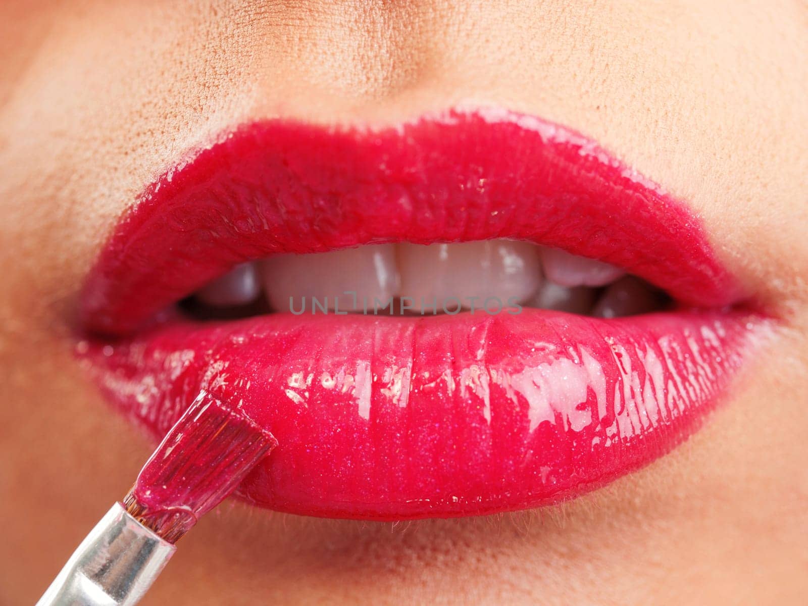 Attractive woman lips with red lipstick, close up