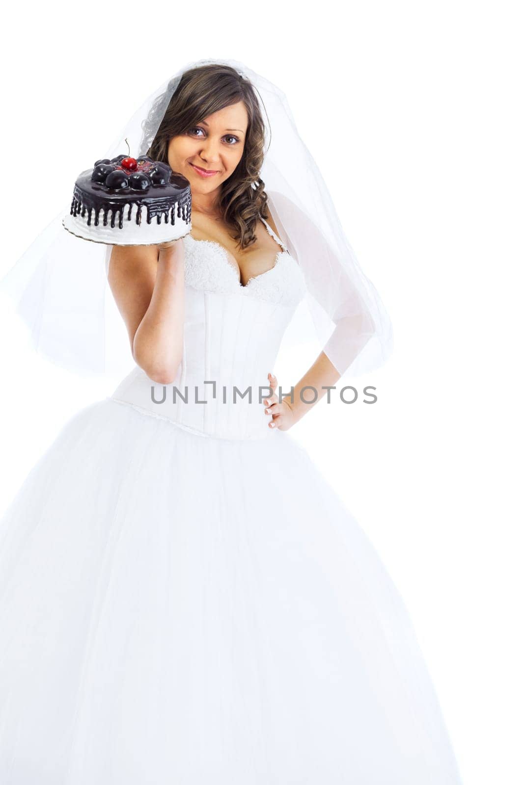 Young bride eating cake isolated on white background