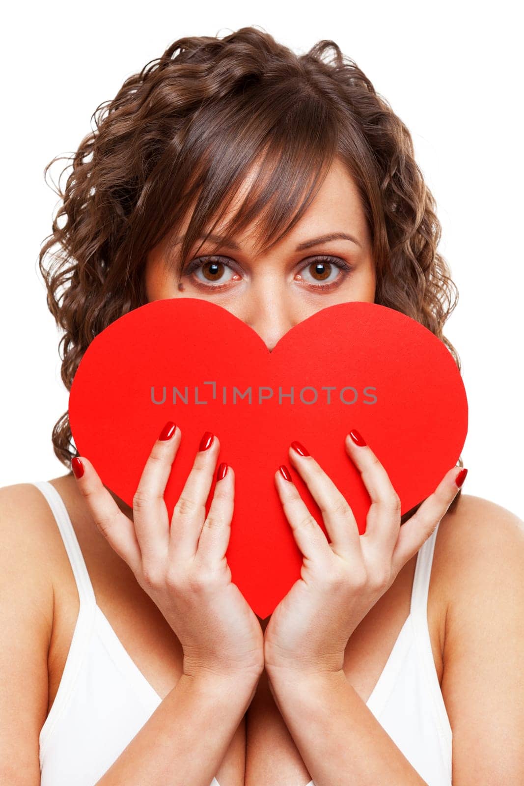Young attractive woman holding red paper heart like a valentine card