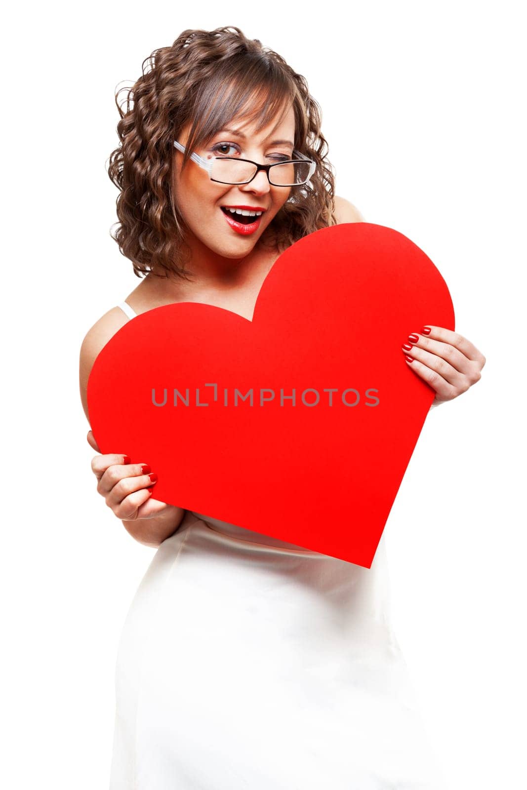 Young attractive woman holding red paper heart like a valentine card