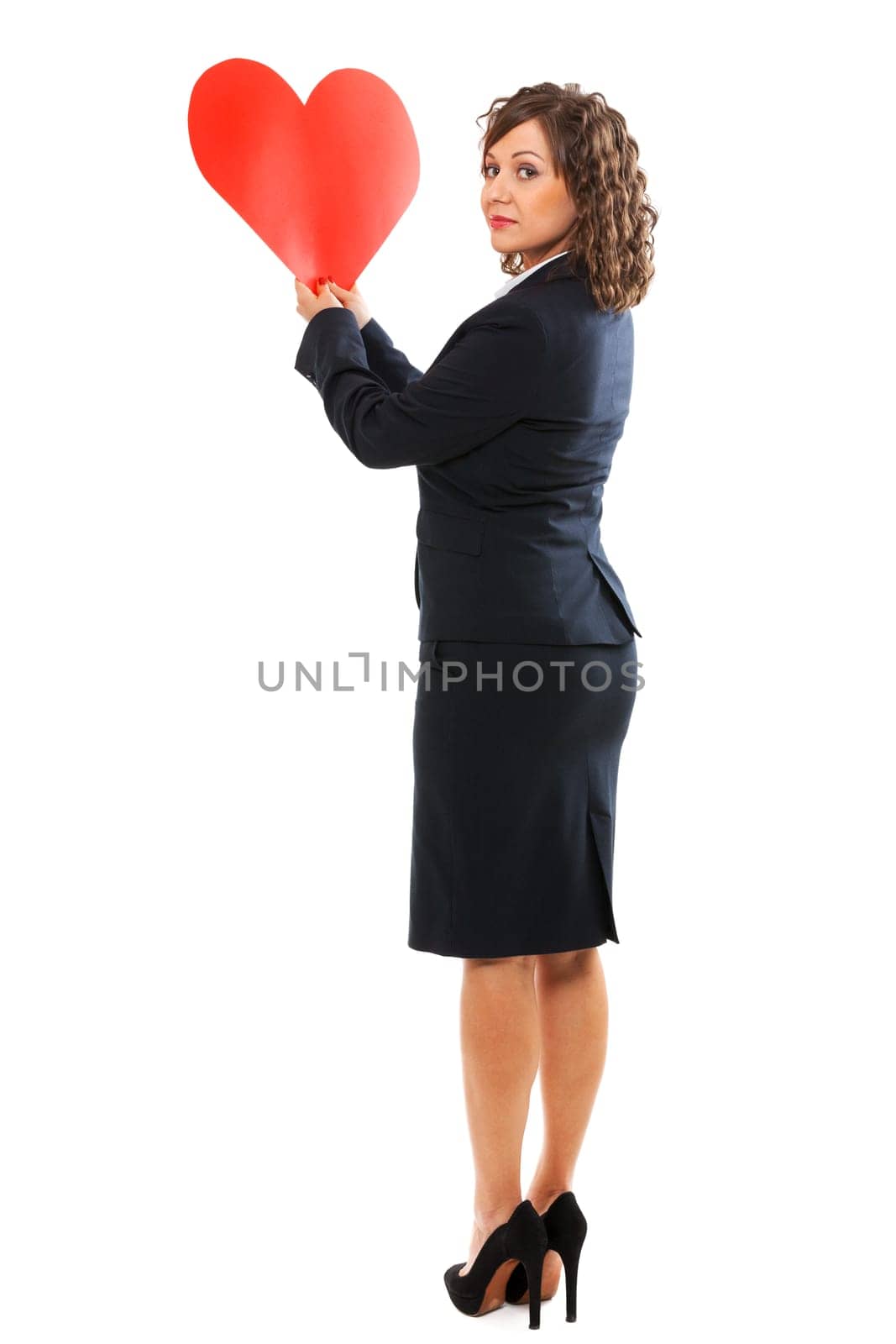 Businesswoman holding red paper heart like a valentine card