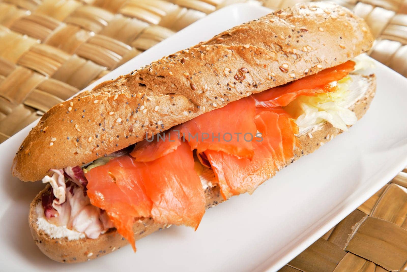 Sandwich with smoked salmon and cream cheese, close up