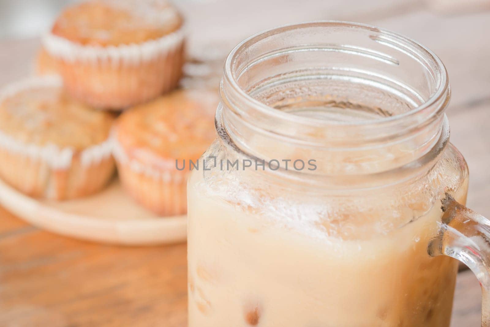 Banana muffins and iced coffee, stock photo