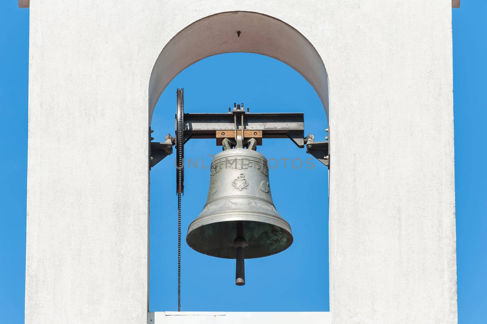Small bell tower with a bell of a country church i