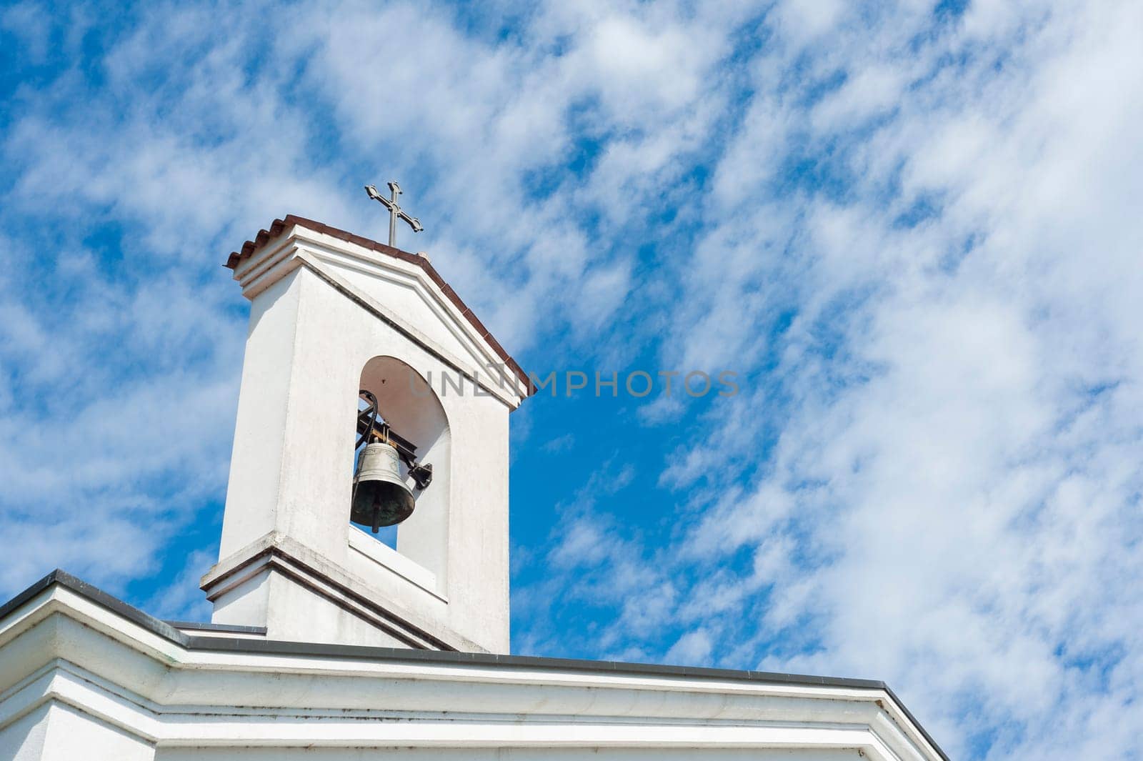 Small bell tower with a bell of a country church i