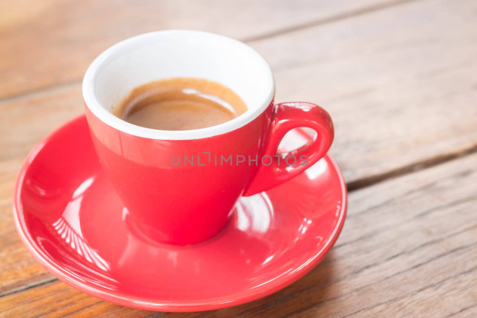 Hot coffee cup on wooden table, stock photo