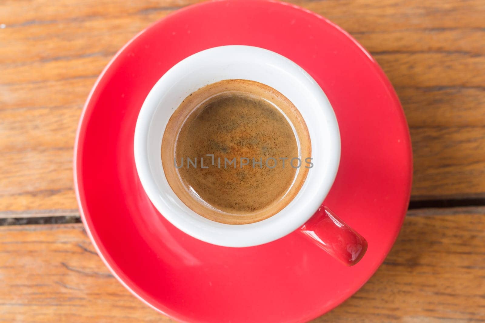 Hot coffee cup on wooden table, stock photo