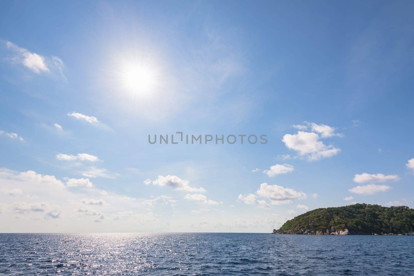 Beautiful landscape of sun on blue sky over the sea in summer at Mu Koh Similan National Park, Phang Nga Province, Thailand