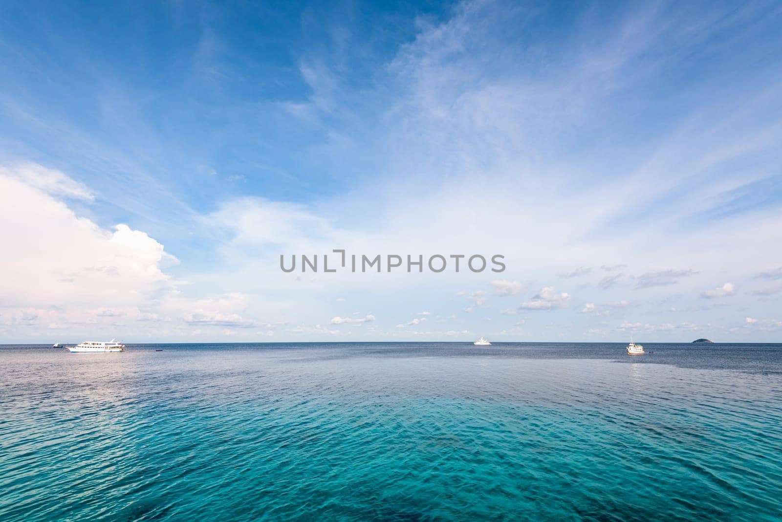 Background blue sky and cloud in summer over Andaman Sea at Honeymoon Bay in Mu Koh Similan island National Park, Phang Nga Province, Thailand