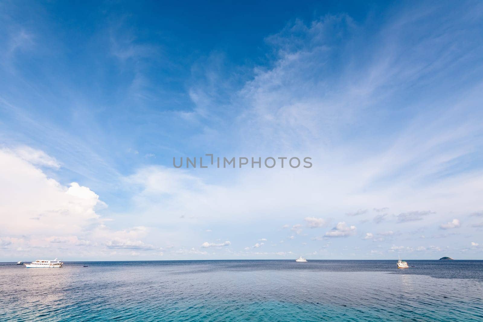 Background blue sky and cloud in summer over Andaman Sea at Honeymoon Bay in Mu Koh Similan island National Park, Phang Nga Province, Thailand