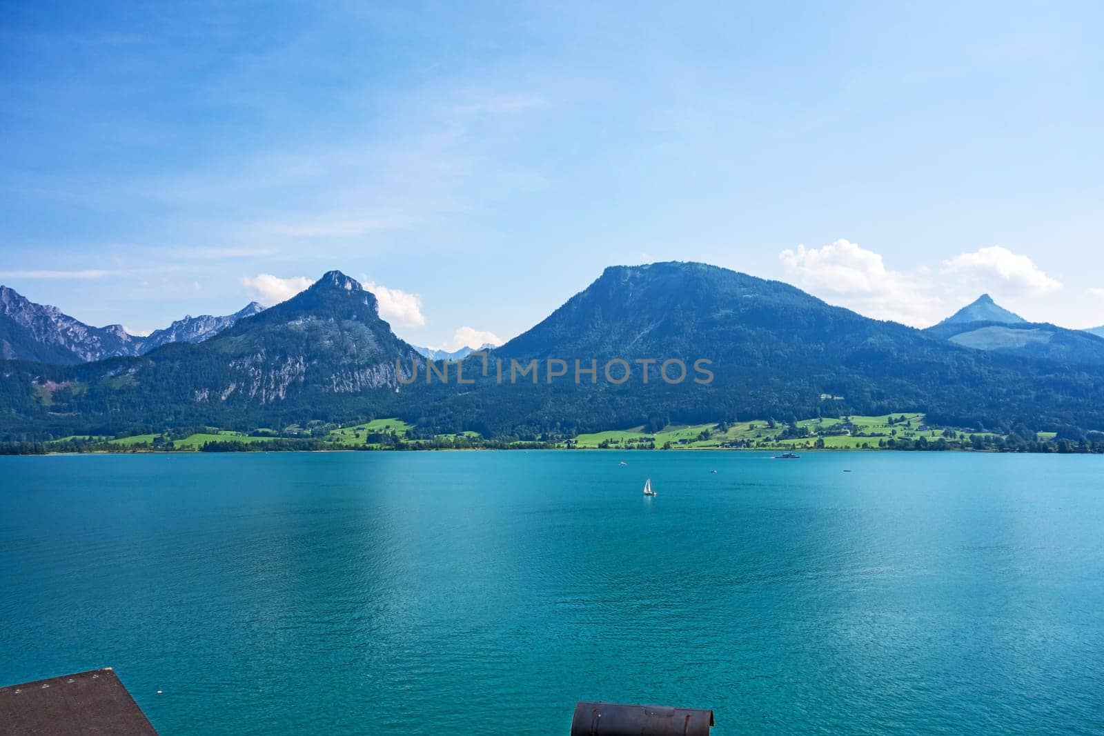 view over the lake Wolfgangsee, Austria, turquoise blue water, mountains in the background