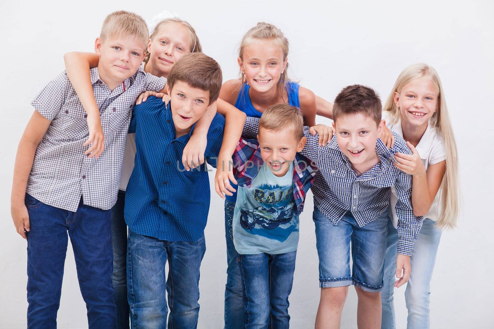 The  happy smiling teenagers on white background.