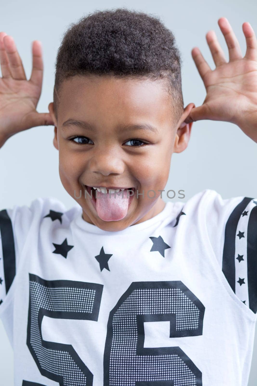 young boy pulling a face at the camera