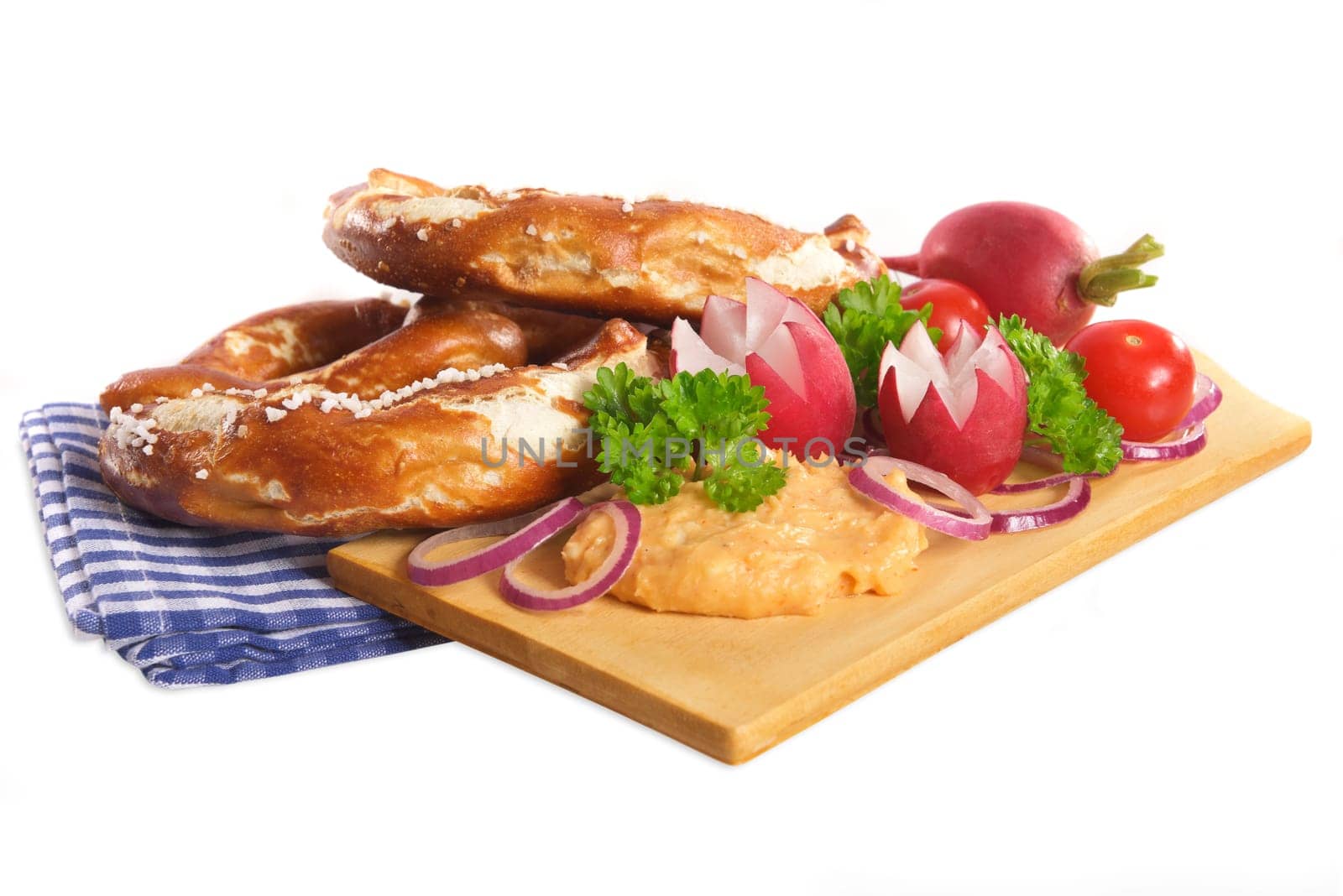 Bavarian vegetarian breakfast with two pretzels and obazda on a white background