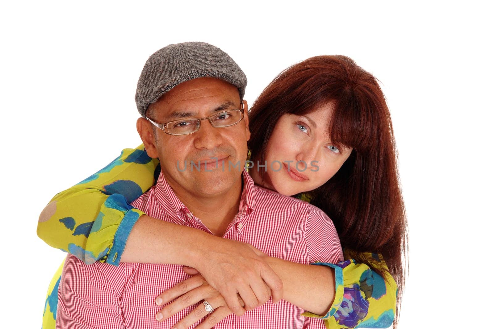 A closeup picture of a happy couple, the Caucasian wife hugging her.Hispanic man from behind, isolated for white background..