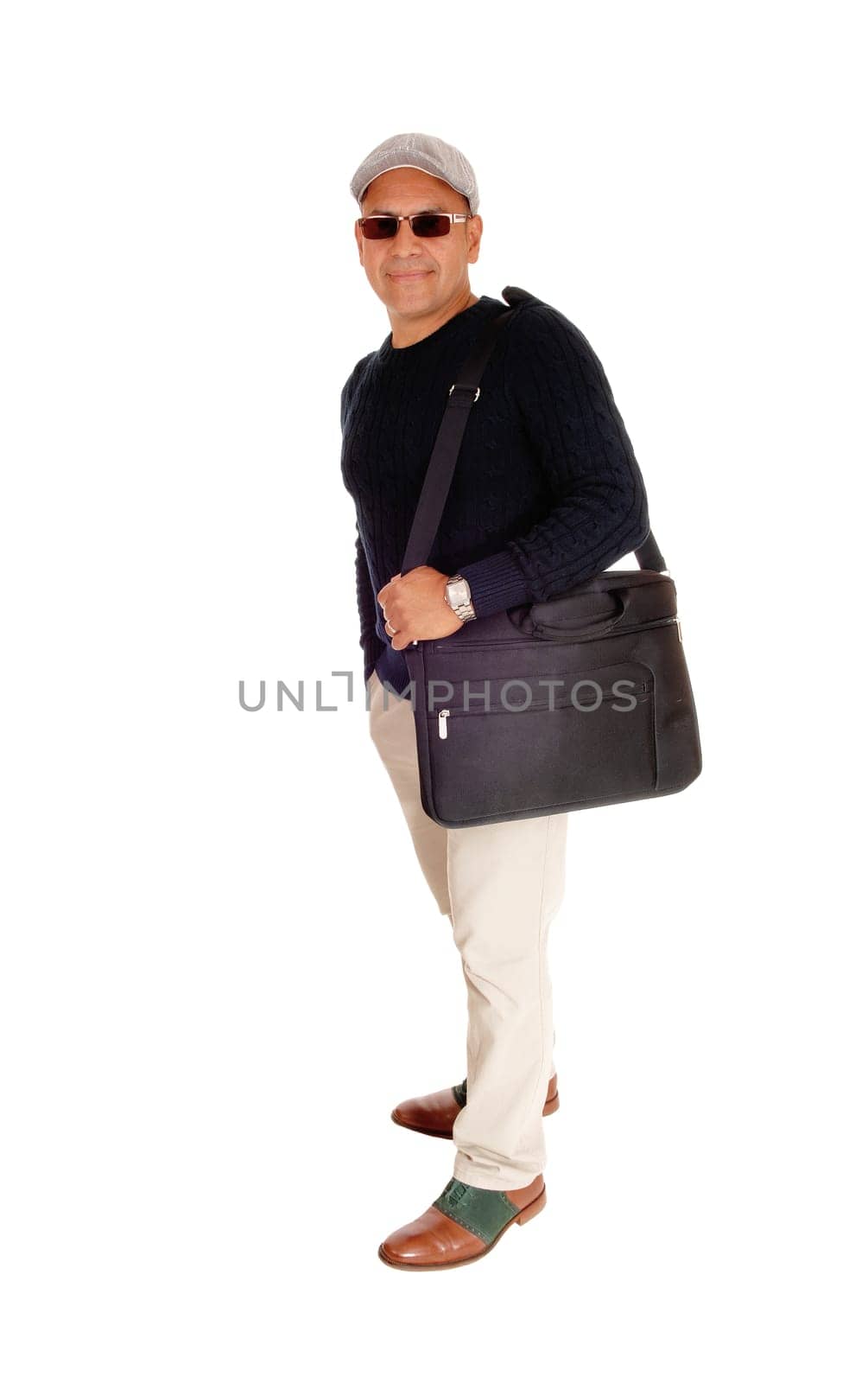 A middle ages Hispanic man standing isolated for white background.caring his laptop with his bag over his shoulder..