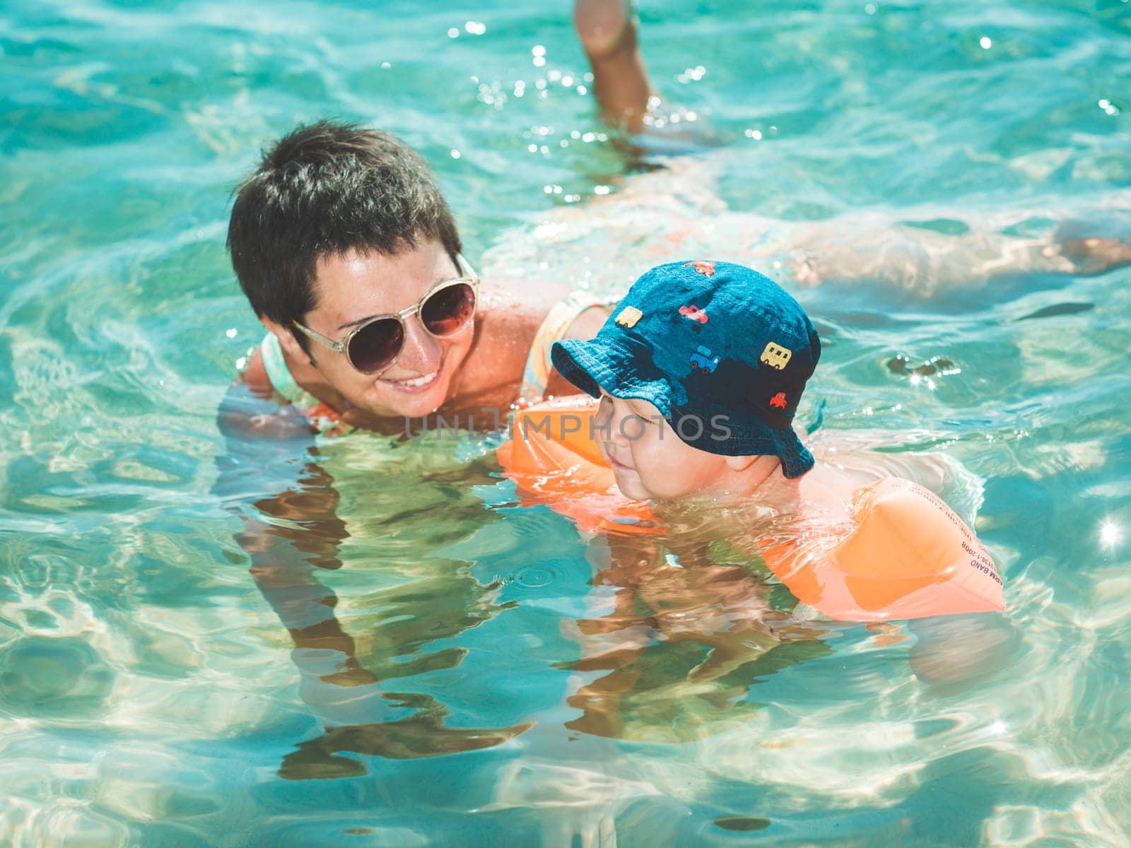 Baby and mother in a sea