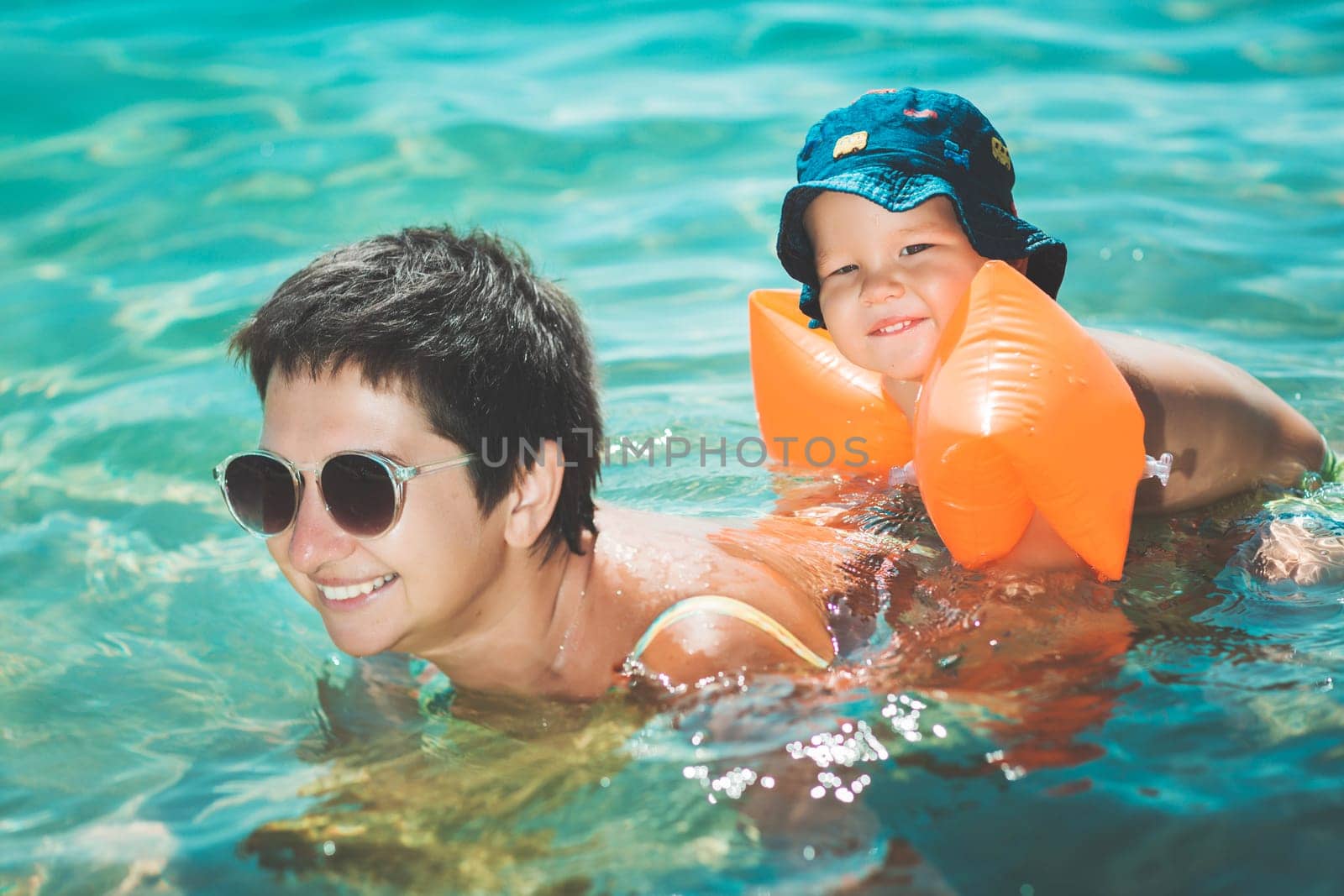Baby and mother in a sea