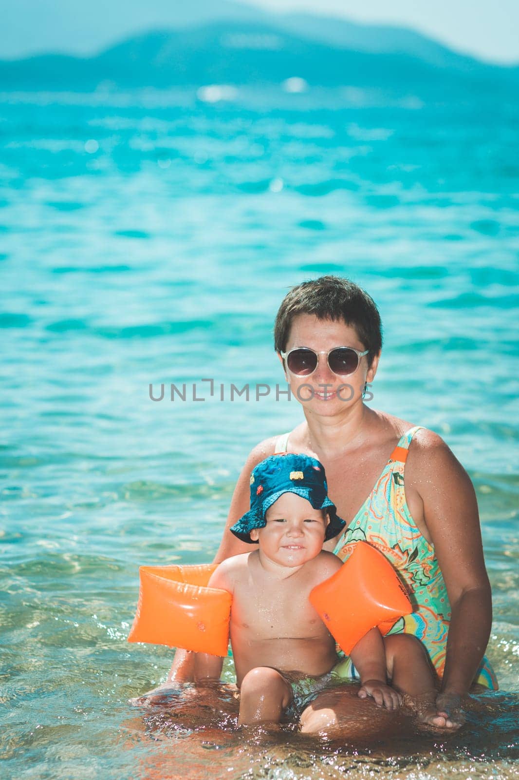 Baby and mother in a sea