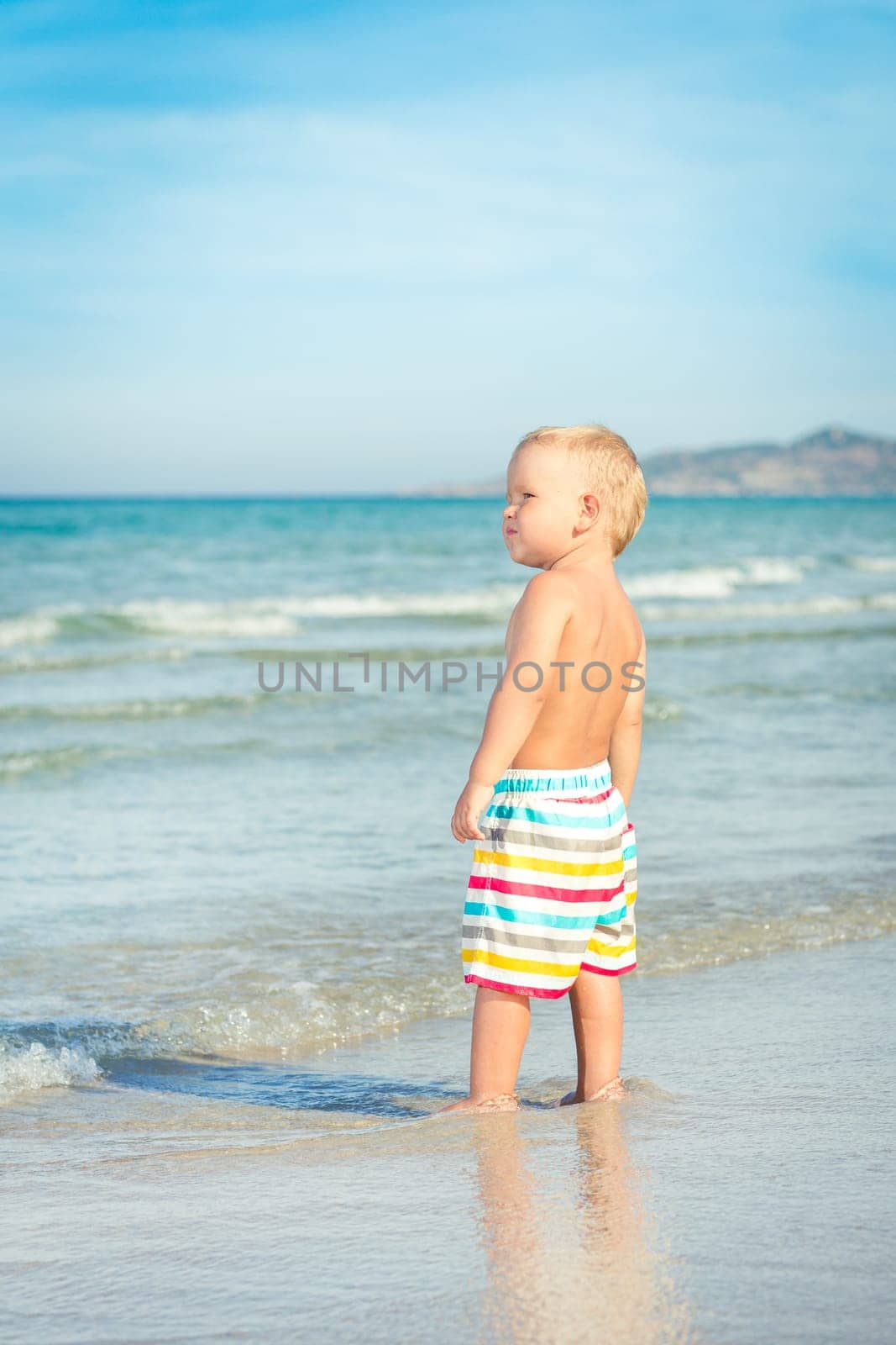 Baby looking sea on the beach