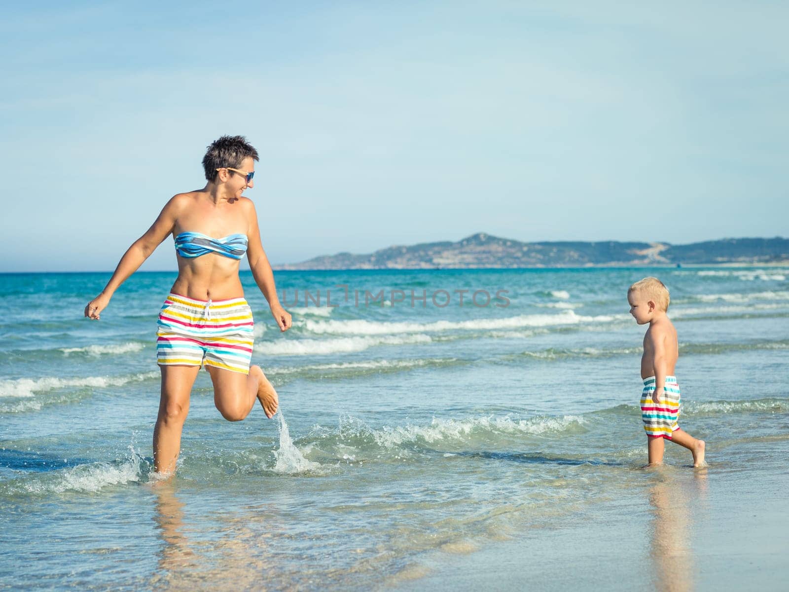 Baby and mother in a sea