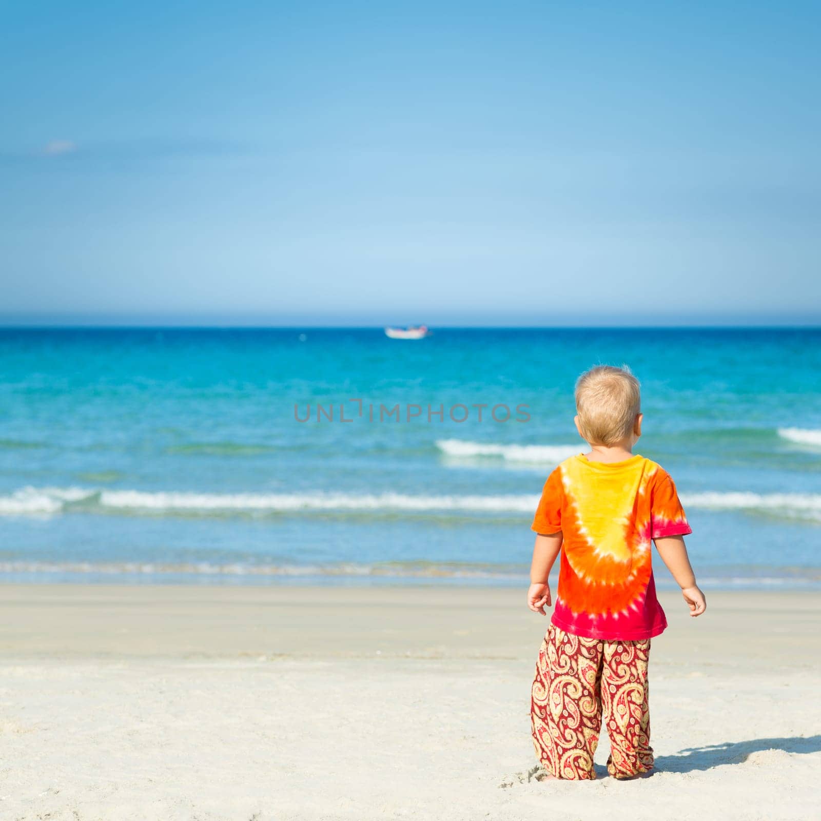 Baby looking sea on the beach