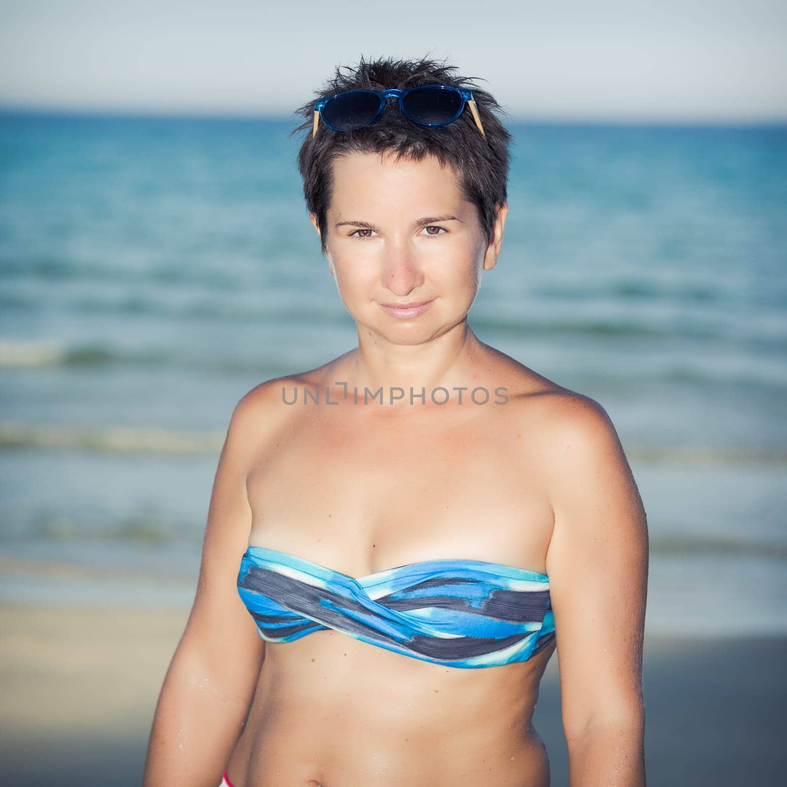 Happy woman near a sea
