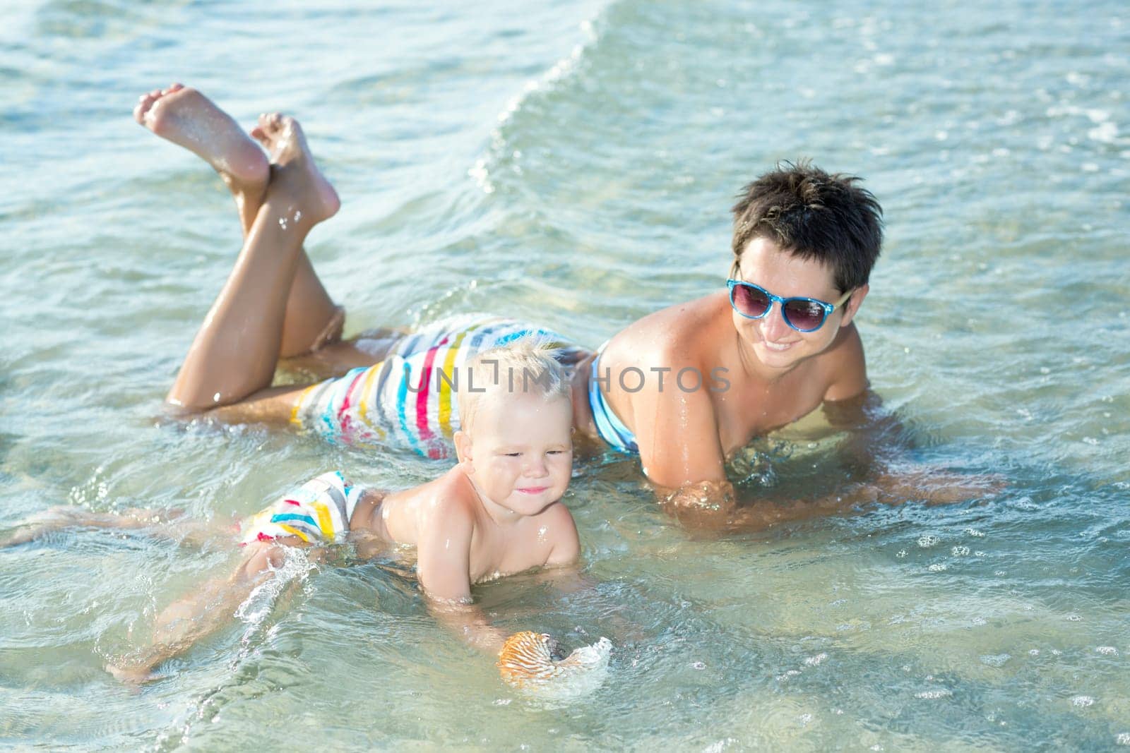 Baby and mother in a sea