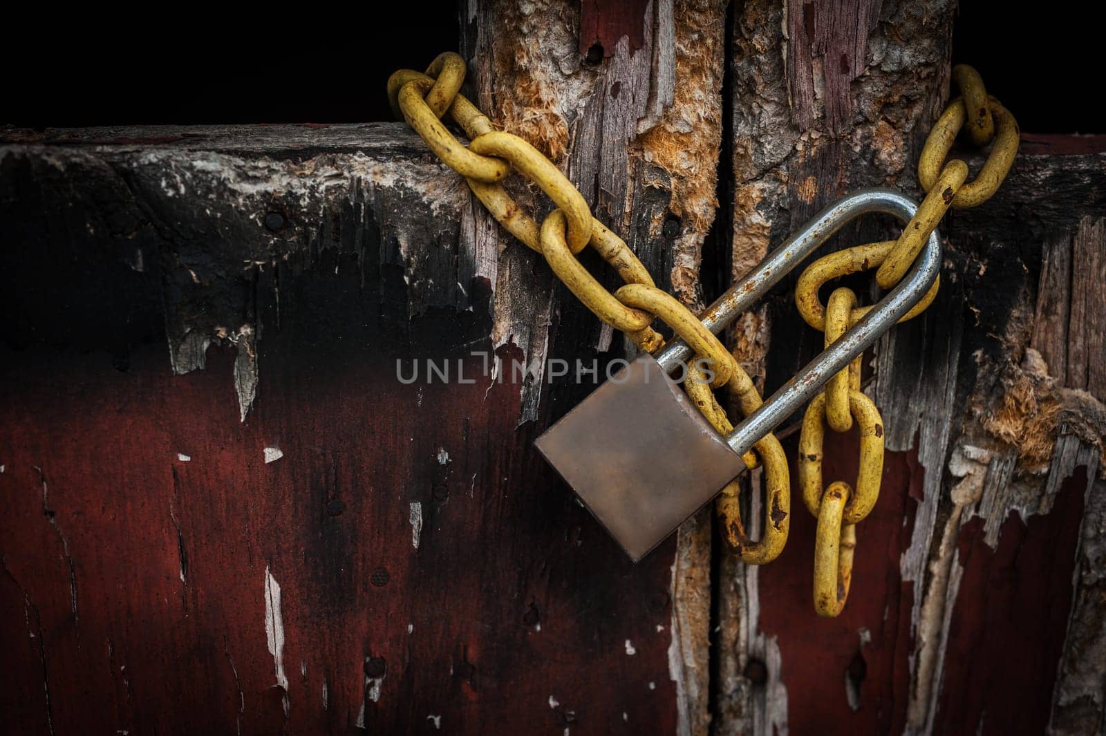 Old master key on old wooden door and shadow background, Selective focus