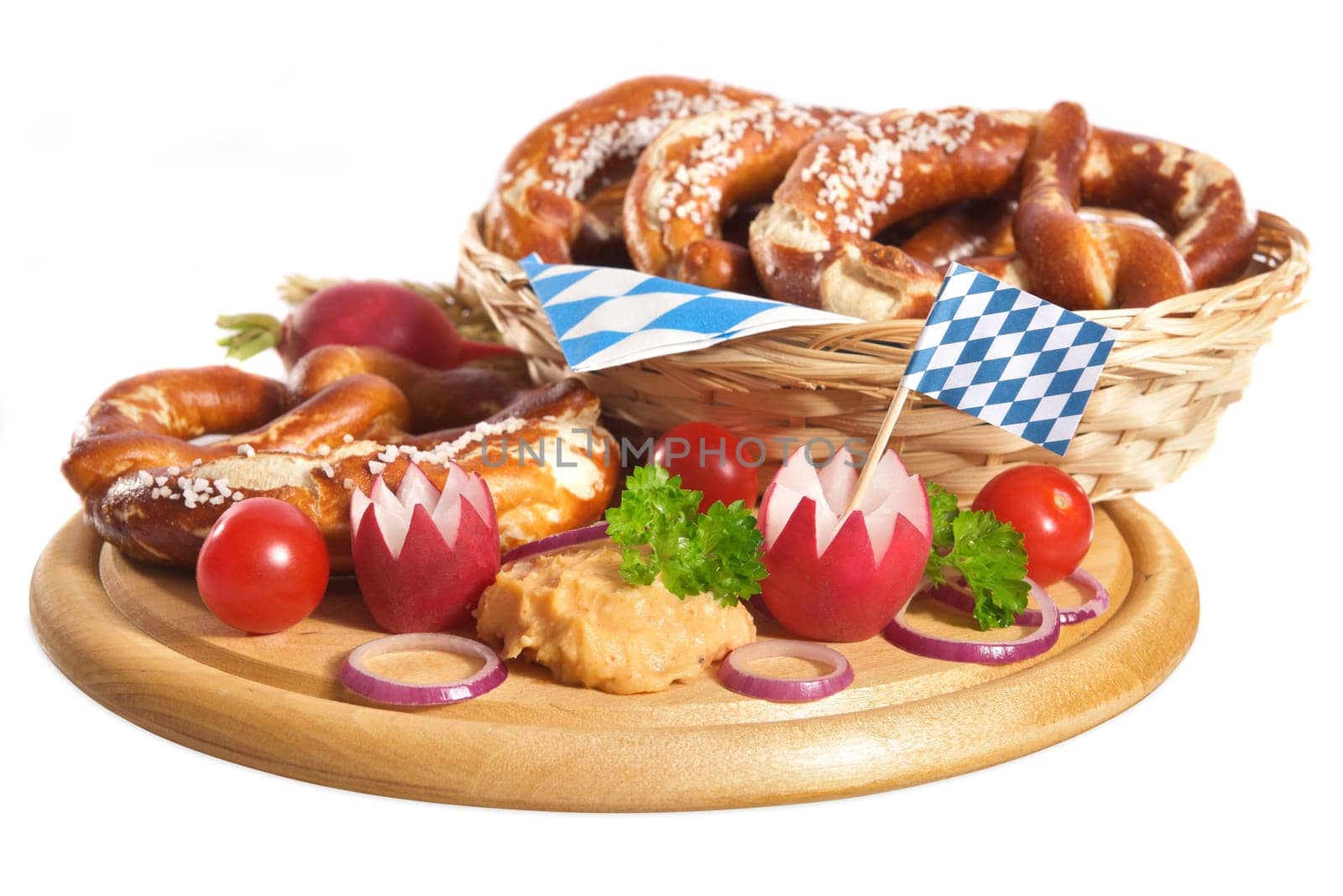 Bavarian vegetarian breakfast with pretzels and obazda on wooden board