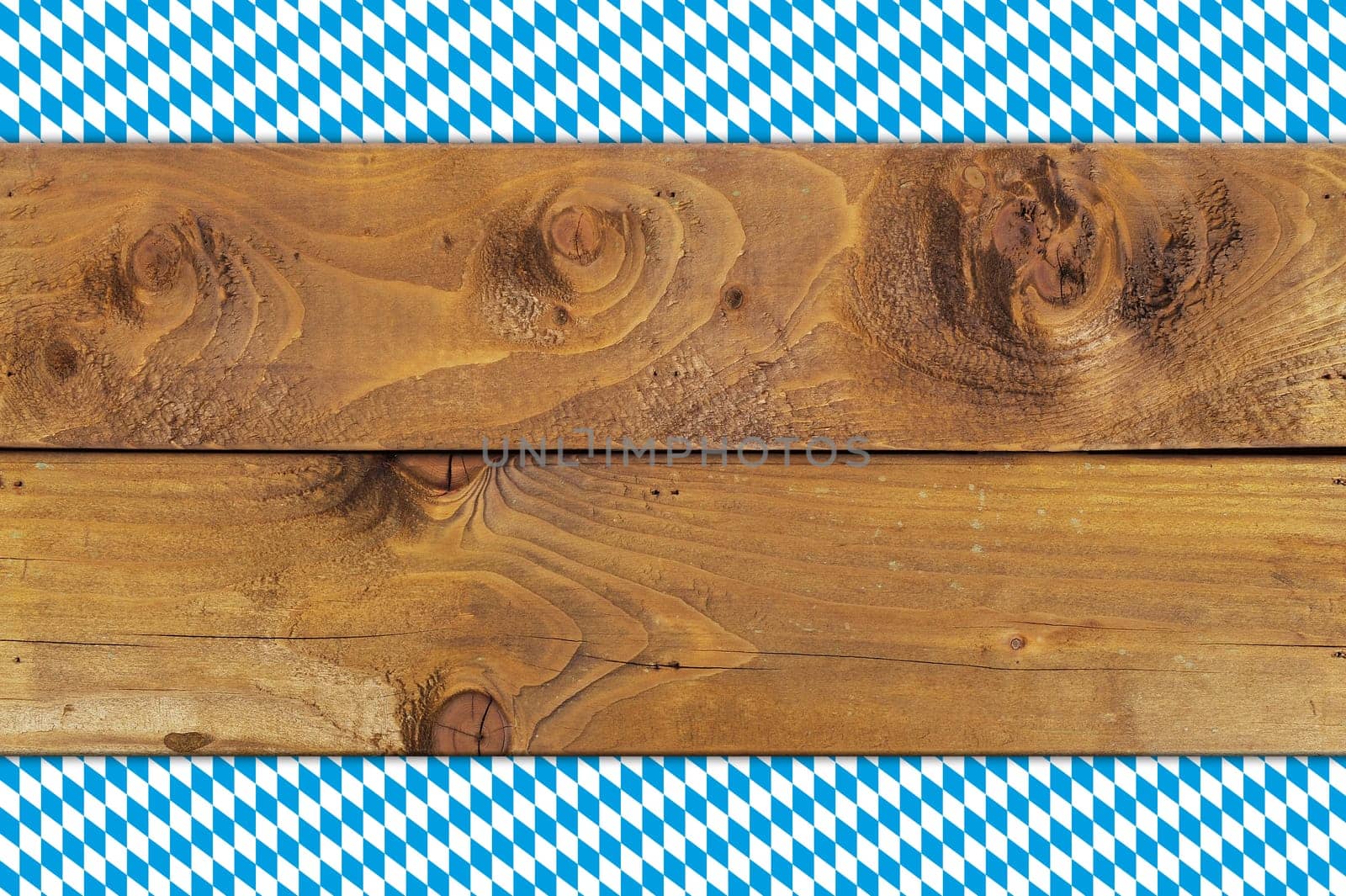 Oktoberfest - original Bavarian flag on old weathered wooden boards. Background with text freedom