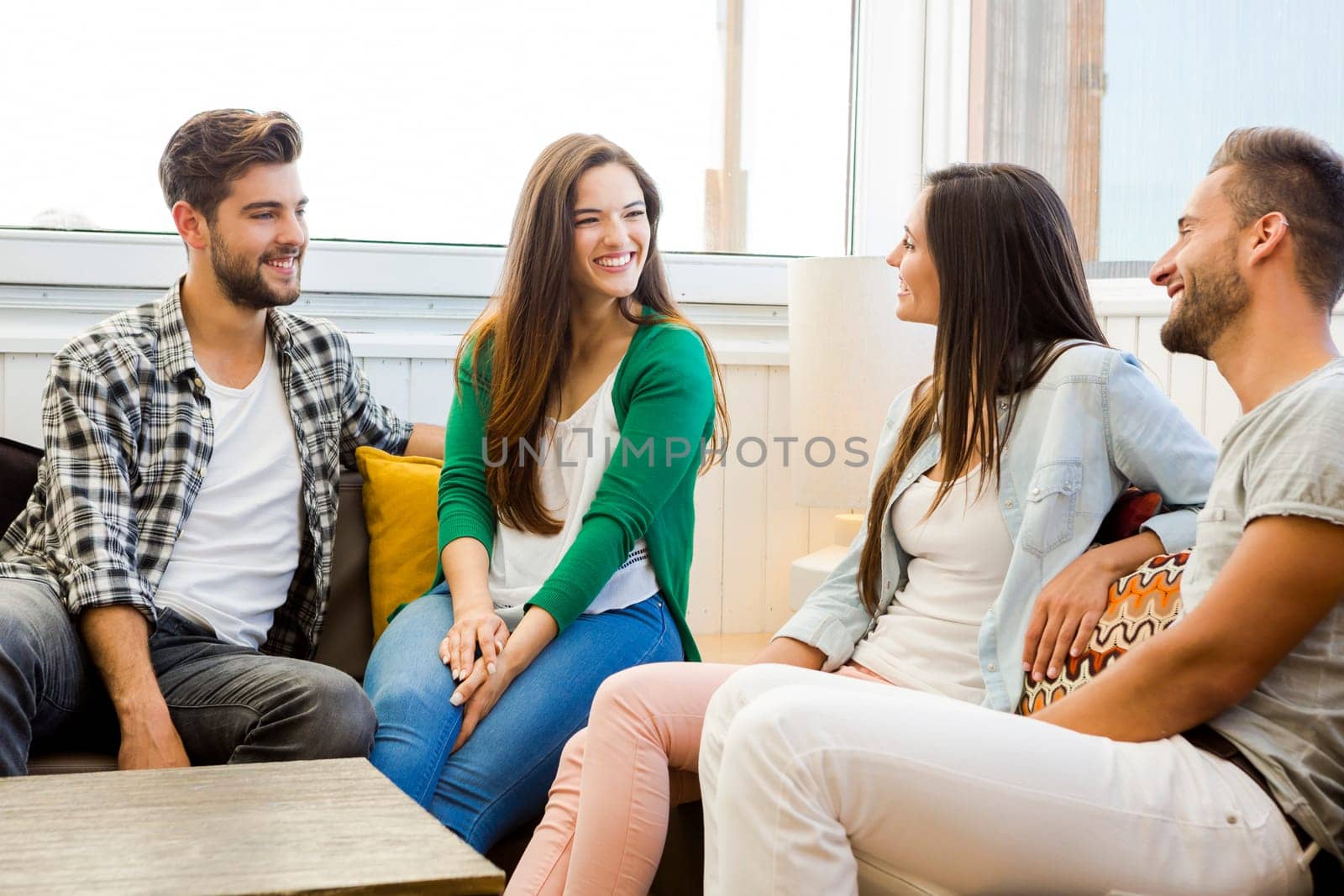 Friends meeting at the local coffee shop and having fun