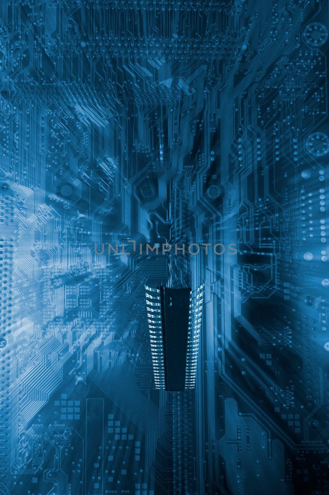 large microchip floating above a circuitboars